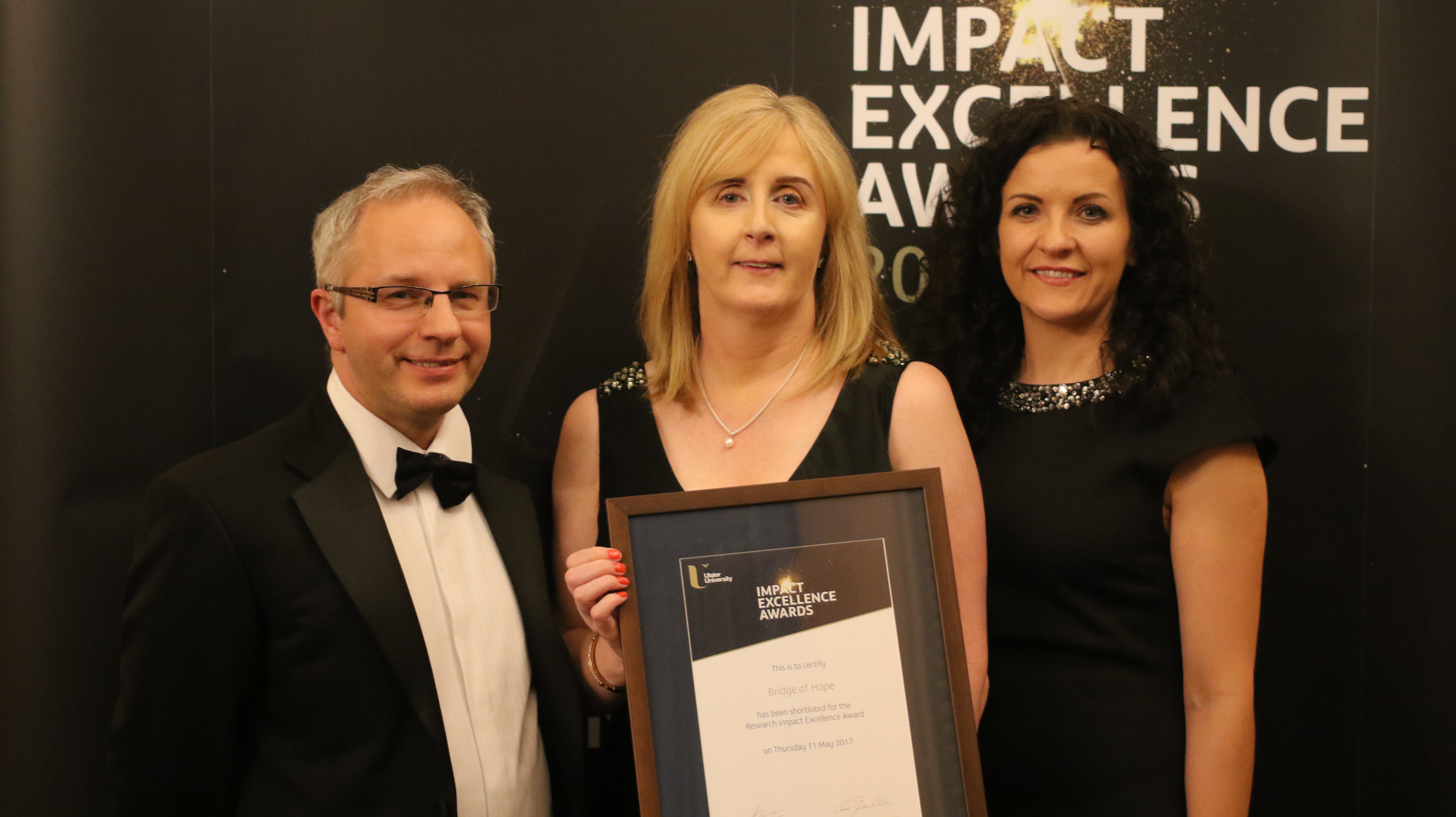 Ulster University Impact Excellence Awards 2017 at Belfast Harbour Commission. TJI Director Rory O'Connell, ACT Head of victims & Mental Health Services Irene Sherry & TJI Research Manager Lisa Thompson. Bridge of Hope was shortlisted for its partnership work with TJI on the Grassroots Toolkit.